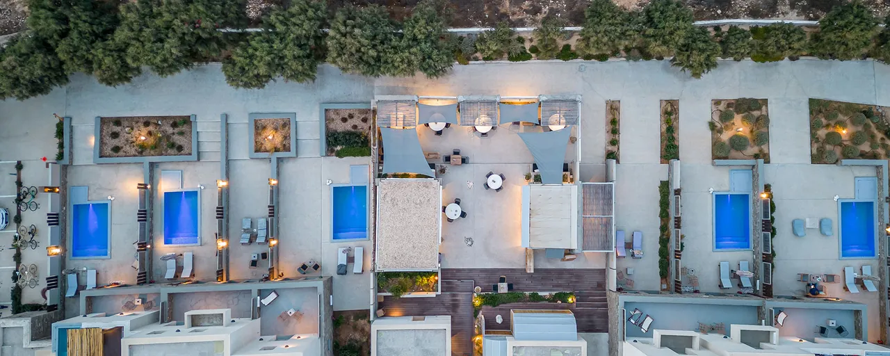Aerial view of the private pools and courtyards of the ground-floor suites at Paros Comfy Suites